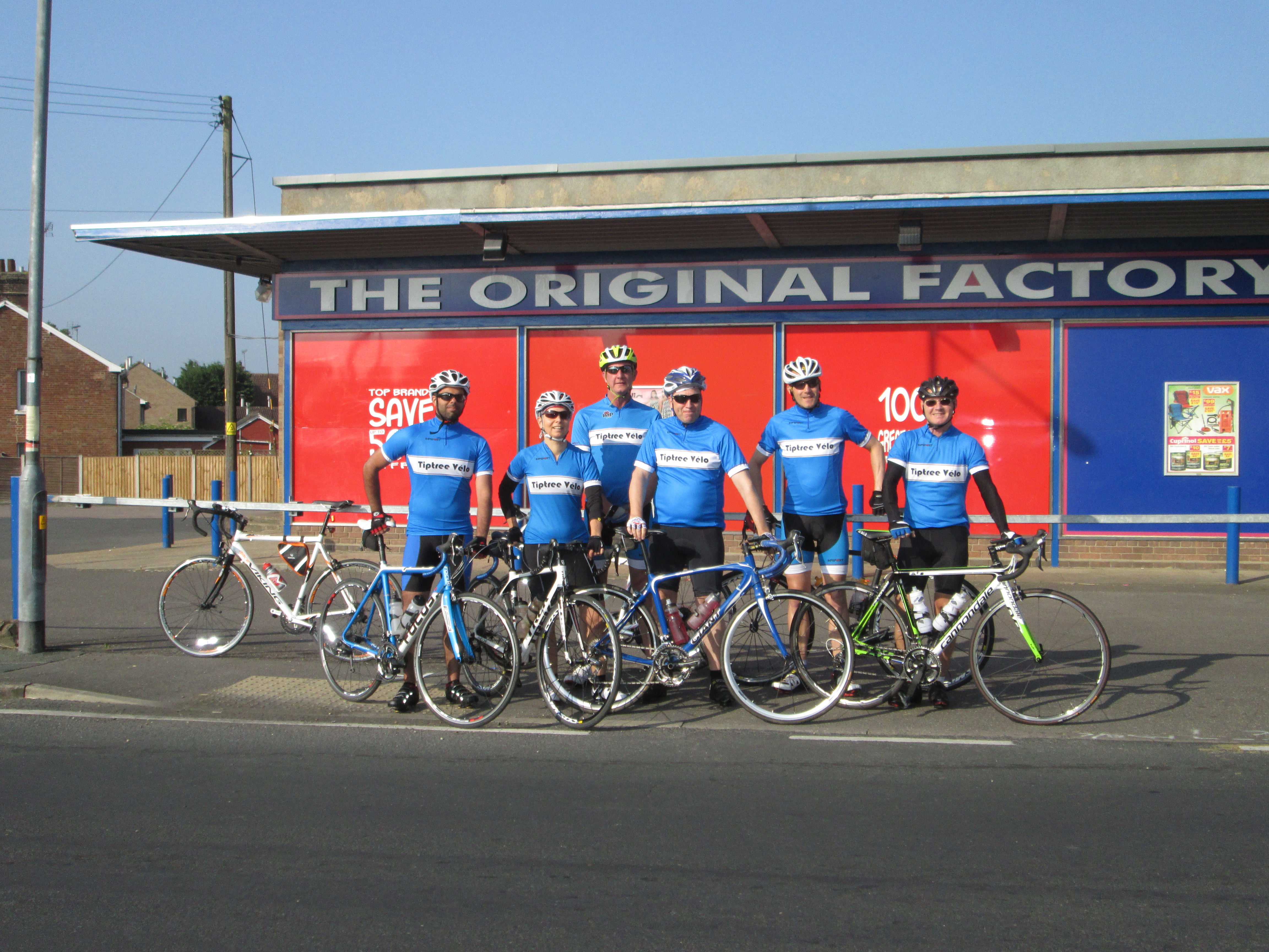 Cyclists from Tiptree Velo, seen outside the Original Factory Shop in Tiptree.